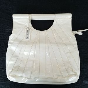Chocolate New York off white patten leather bag